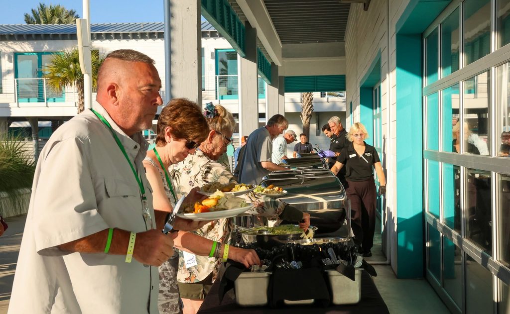 Owners serving themselves at a rally buffet dinner